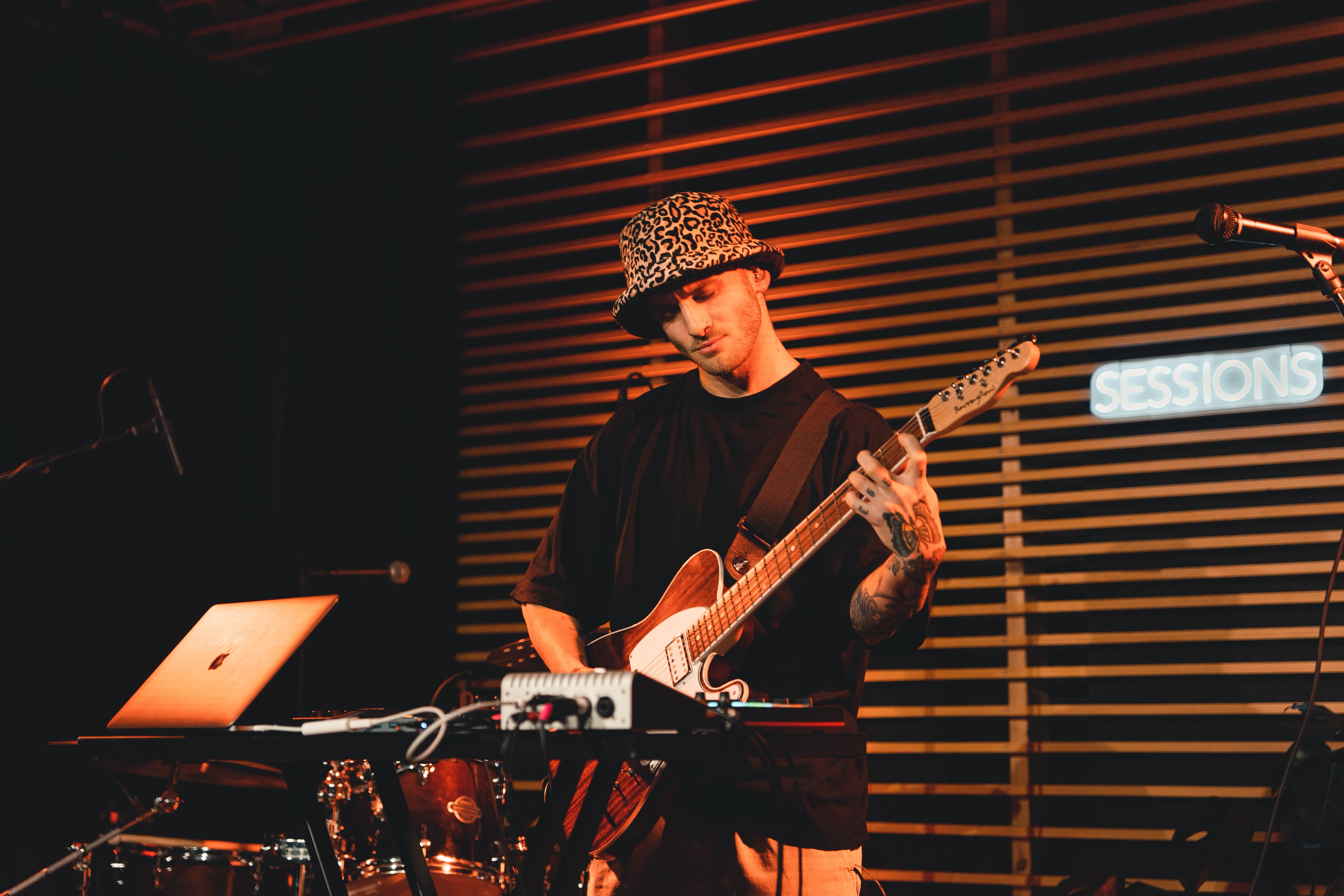Mateo playing guitar live on stage