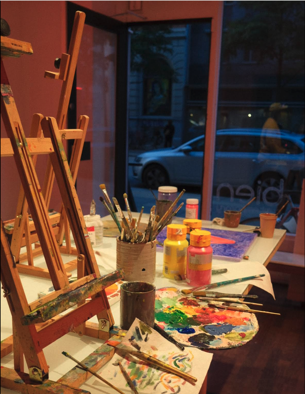 Cocktails and art materials on a table